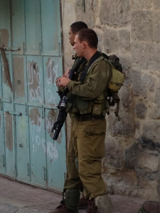 Soldiers Patrolling the Old City of Hebron Photo Credit: Dawn